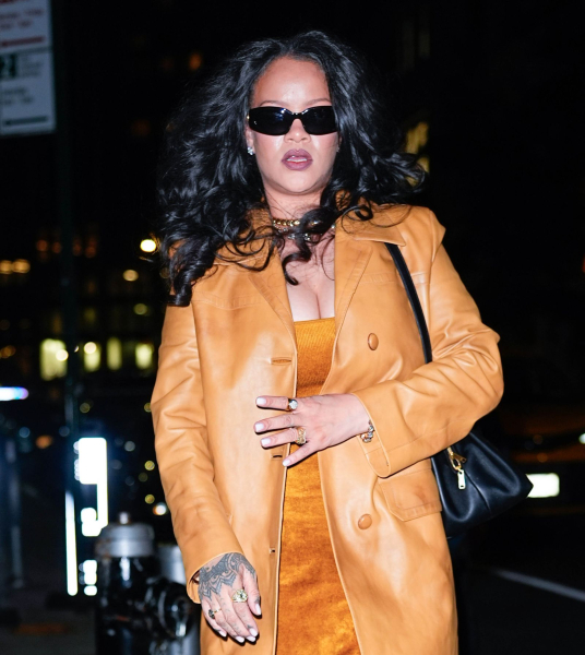 Rihanna walking in NYC wearing a camel leather coat and fuzzy dress