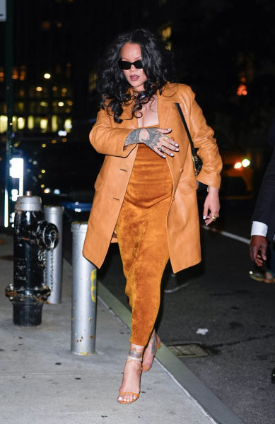 Rihanna walking in NYC wearing a camel leather coat and fuzzy dress