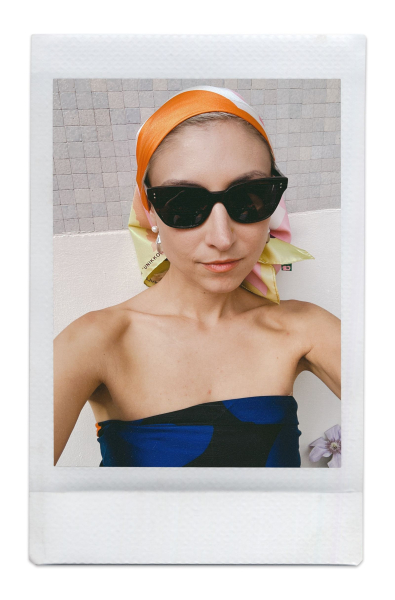 An image of content creator Jenny Walton wearing a headscarf and sunglasses.